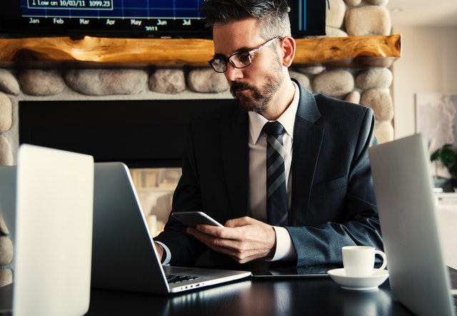 man at computer finances